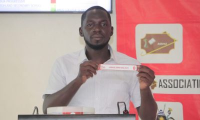 Draw assistant Solomon Walusimbi during the draw